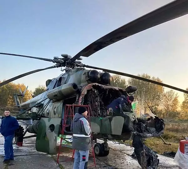  Doi copii au dat foc unui elicopter, intr-o unitate militara din Rusia. Sustin ca li s-a promis o recompensa de 20.000 de dolari