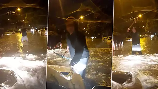 Haos total in Bucuresti dupa furtuna. Un sofer si-a continuat drumul prin inundatii, desi a fost avertizat de un barbat ce tinea un tarnacop in mana